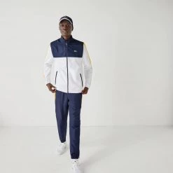 Lacoste Tracksuit - ColorBlocked - Navy With White And Yellow - WH2104 Shop All 8 Lacoste Tracksuit - ColorBlocked - Navy With White And Yellow - WH2104 Shop All